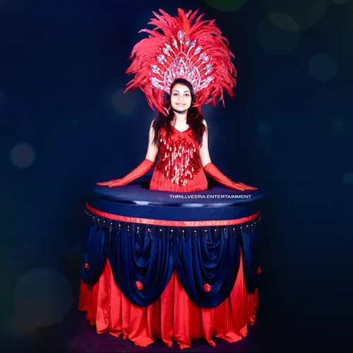 Elegant roaming table hostess by Thrillveera Entertainment serving guests with style and interactive charm at a live event.