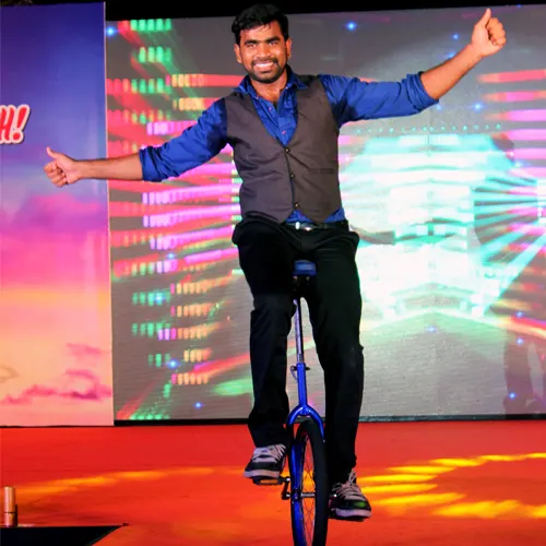Thrillveera Entertainment unicycle performer showcasing balance and dynamic movement during a live event.